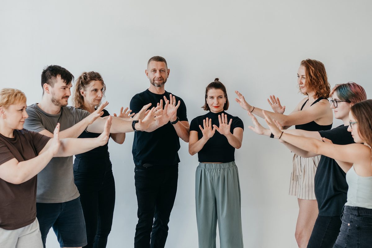 A diverse group practicing boundary-setting and de-escalation at a Modern Self-Defense workshop